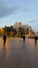 Evening street life captured across central Barcelona squares