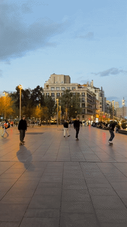 Evening street life captured across central Barcelona squares
