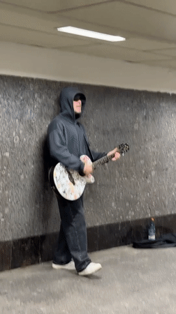 Street musician performs in Moscow Metro subway tunnel