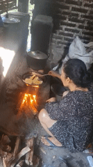 Traditional cooking and roof repairs in a Semanding village