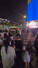 Busy nighttime shopping district activity captured in Shangcheng District