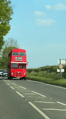 Double-decker bus travels countryside road near Amersham