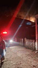 Hillside fire draws firefighters, onlookers in Lhokseumawe, Indonesia