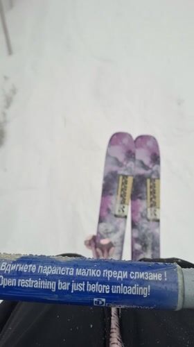 Ski lift ride captured during snowfall in Bansko