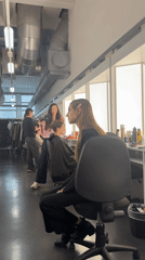 Fashion prep session documented in Milan industrial space