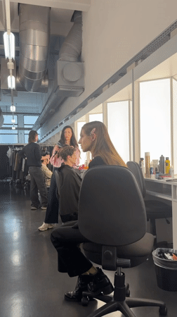 Fashion prep session documented in Milan industrial space