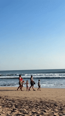Morning beach life unfolds in Kuta, Indonesia