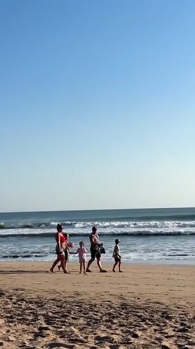 Morning beach life unfolds in Kuta, Indonesia