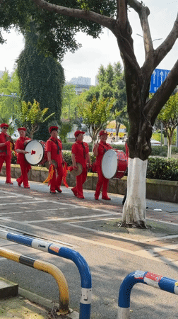 Women in red perform percussion parade in Chongqing