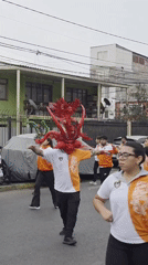 Street dancing with dragon mask performance in Iquique
