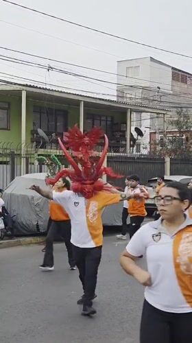 Street dancing with dragon mask performance in Iquique