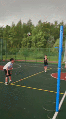 Casual volleyball game observed at outdoor sports complex
