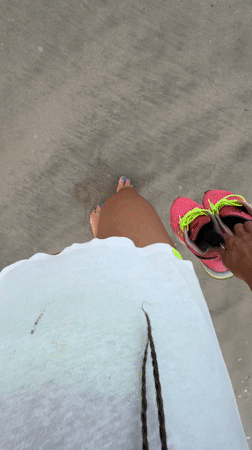 Barefoot evening beach walk captured in Jimbaran, Indonesia