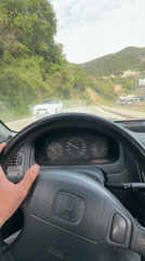 Driver navigates Honda Civic through Montenegro mountain roads