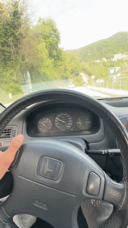 Driver navigates Honda Civic through Montenegro mountain roads