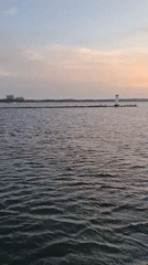 Lighthouse at the end of a pier, Świnoujście at dusk
