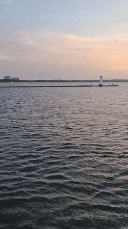 Lighthouse at the end of a pier, Świnoujście at dusk