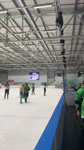 Ice hockey game in progress at Qalansawe indoor rink
