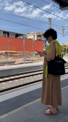 Regional train arrives at Castelldefels station, midday