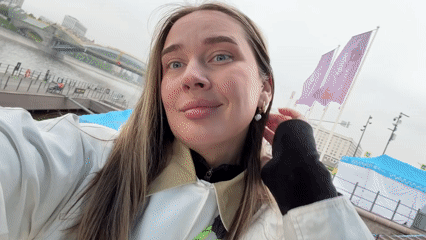 Woman takes selfie video near Moscow River waterfront