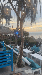 Beachside bar 'So Bien' captured during busy sunset period