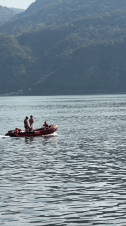Lakeside afternoon on Lake Como, boats and docks