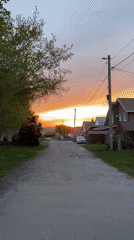 Sunset scene documented on rural road in Ulyanovsk, Russia