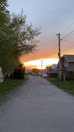 Sunset scene documented on rural road in Ulyanovsk, Russia