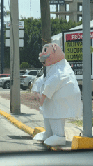 Mascot costume character spotted on Mexican street sidewalk