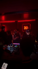DJ performs for club crowd in Shangcheng District