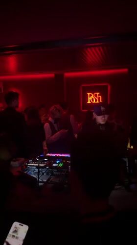 DJ performs for club crowd in Shangcheng District