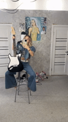 Woman films guitar content in Abakan indoor session