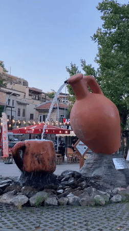 Terracotta jug-and-mug fountain in Avanos town square