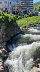 Urban river cascades through Gabrovo, Bulgaria creating natural waterfalls