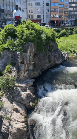 Urban river cascades through Gabrovo, Bulgaria creating natural waterfalls