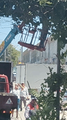 Tree pruning crew with crane and chainsaw works Shymkent street
