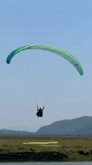 Morning paragliding and recreation activities documented near Pokhara lake