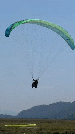 Morning paragliding and recreation activities documented near Pokhara lake