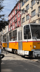 Tram 3018 operates on Sofia street amid pedestrian activity