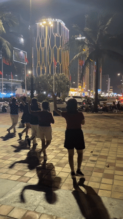 Evening dance gathering at Da Nang Beach boardwalk
