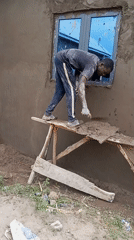 Construction workers plaster buildings in Zango-ndaji, Nigeria