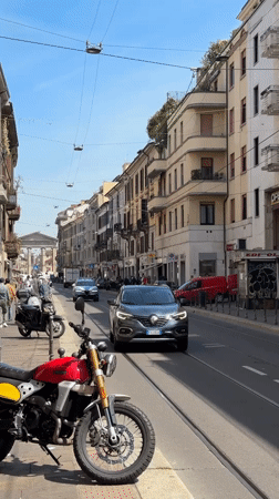 Morning street life documented across central Milan neighborhoods