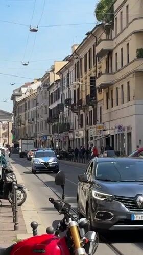 Morning street life documented across central Milan neighborhoods