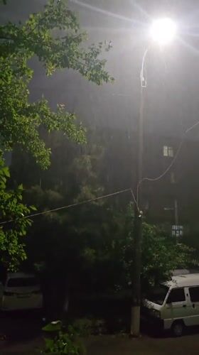 Rainstorm observed in Tashkent under streetlight illumination