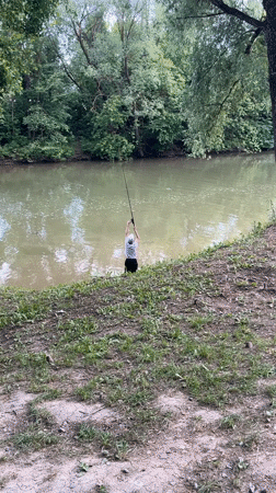 Wading and fishing on a quiet Russian riverbank
