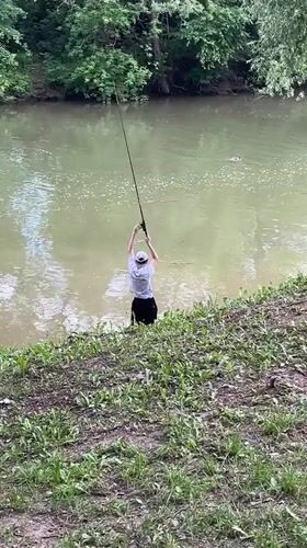Wading and fishing on a quiet Russian riverbank