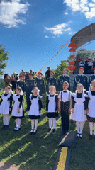 Children's choir in Soviet-style uniforms performs outdoors in Saint Petersburg