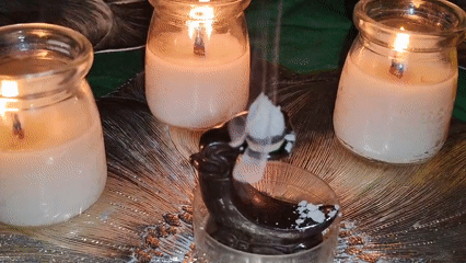 Candles, incense, and ritual figurines arranged in Izhevsk