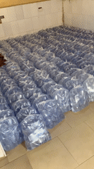 Plastic bottle storage facility documented in Jos, Nigeria