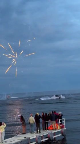 Fireworks over Lake Baikal at dusk, Listvyanka